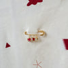Gold decorative charms with Qatar inspired accent with a baby blanket
