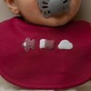 Baby wearing Qatar baby bib