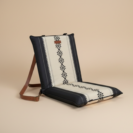 Floor chair pad with intricate Sadu patterns on a beige background