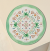 Multifunctional serving board with floral and palm tree design on a beige background